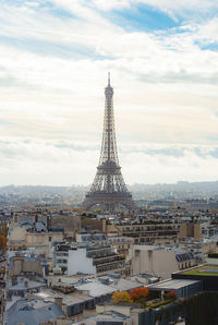 Tower in city against sky