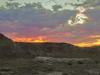 Scenic view of landscape against sky during sunset