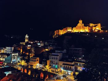 Illuminated buildings in city at night