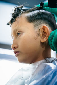 Close-up portrait of boy looking at camera