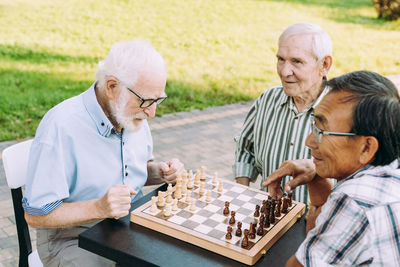 Man playing on chess board