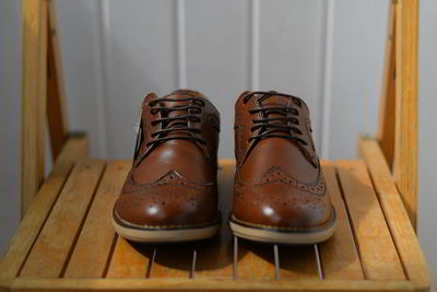 High angle view of shoes on wooden table