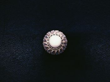 Close-up of electric lamp on table