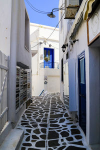 Empty alley amidst buildings