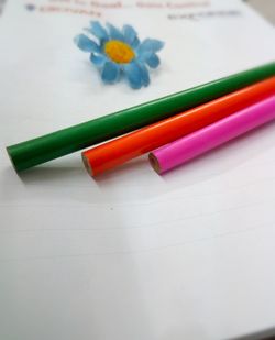 Close-up of multi colored paper on table