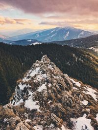 Scenic view of snowcapped mountains against sky during sunset