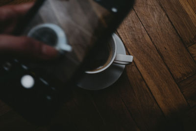 High angle view of coffee cup on table