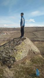 Full length of man standing on rock