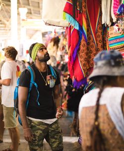 People standing against market stall