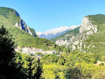 Scenic view of mountains against clear blue sky