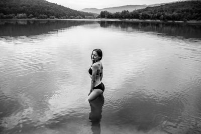 Full length of young woman in lake