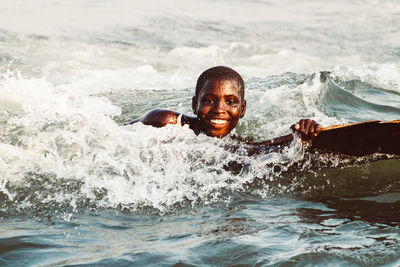 Portrait of woman swimming in sea