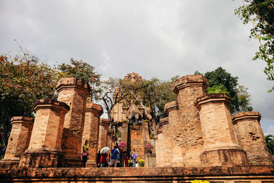 View of old temple against cloudy sky