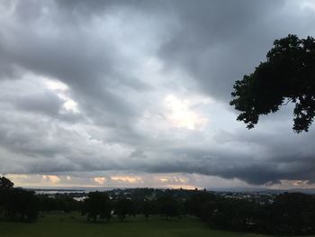 Scenic view of field against sky during sunset