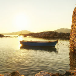 Scenic view of lake against clear sky during sunset