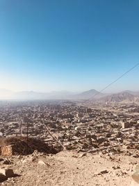 Aerial view of cityscape against clear sky