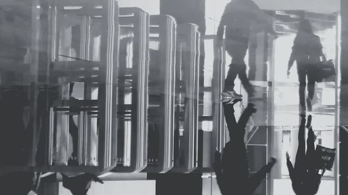 Rear view of people walking in corridor