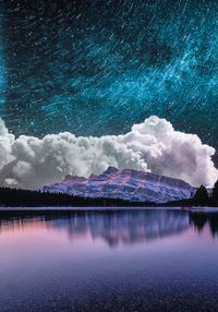 Scenic view of lake against sky at night