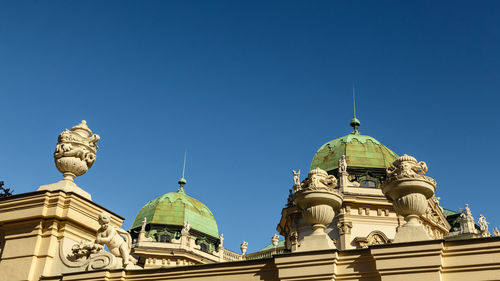 Low angle view of church against clear blue sky