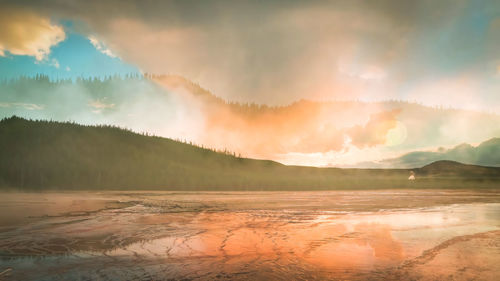 Scenic view of lake against sky during sunset,yellowstone wyoming