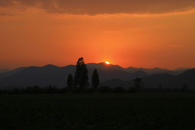 Scenic view of silhouette landscape against sky during sunset
