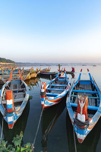 Boats moored at harbor