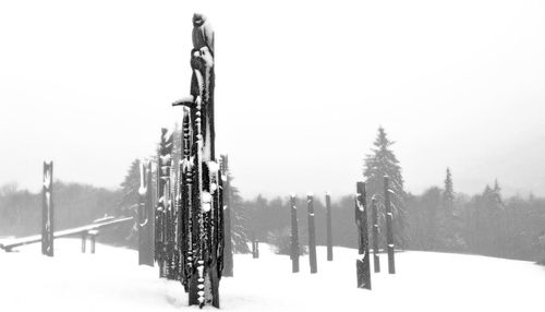 Panoramic shot of snow covered land against sky