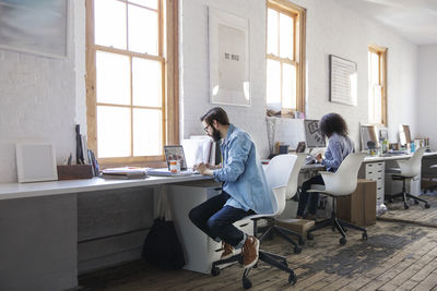 Business people working at desk in creative office