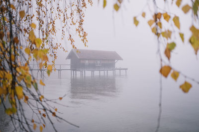 Built structure by lake during winter