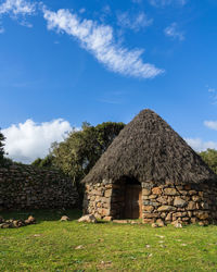 House on field against sky