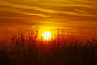 Scenic view of dramatic sky during sunset