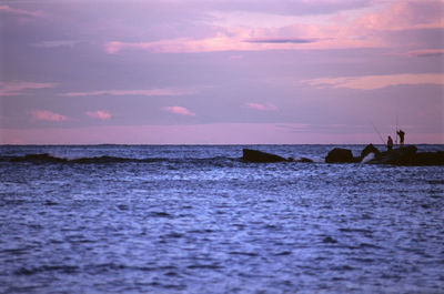 Scenic view of sea against cloudy sky