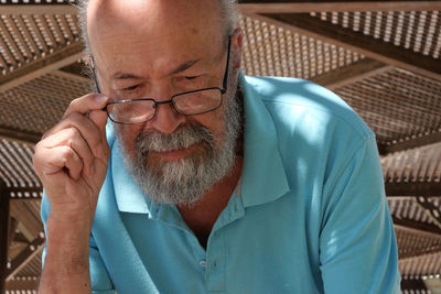 Senior man looking down 