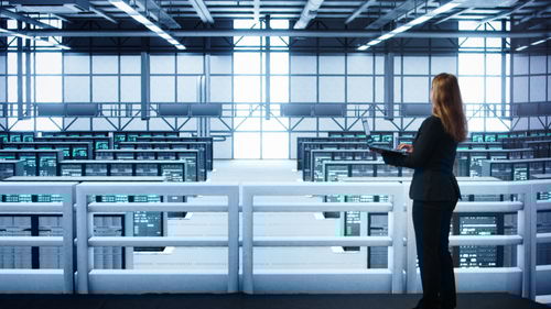 Low angle view of man standing on escalator