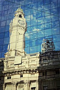 Low angle view of buildings against blue sky