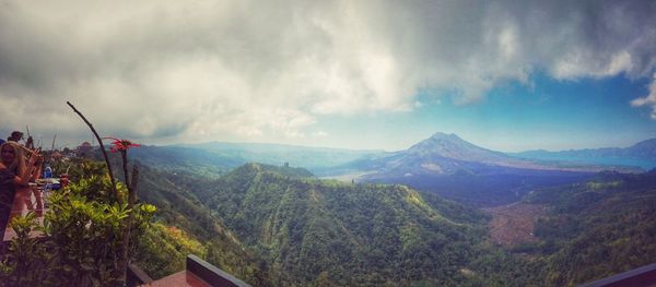 Scenic view of mountains against cloudy sky