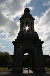 Low angle view of historical building against cloudy sky