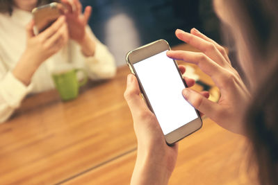 Midsection of man using mobile phone