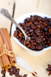 Close-up of roasted coffee beans on table