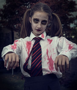 Portrait of teenage girl dressed as zombie