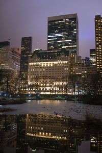 Illuminated buildings in city at night
