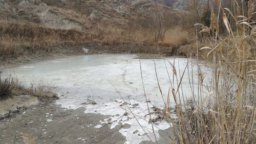 Close-up of snow on water