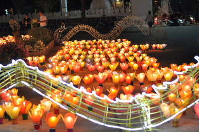 Various fruits on display at night