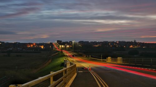 High angle view of light trails on road against sky