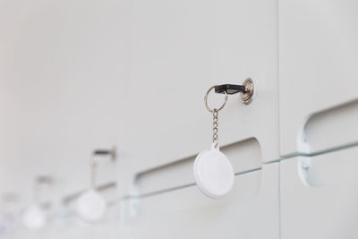 Low angle view of decoration hanging on wall at home