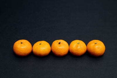 Close-up of oranges against orange background