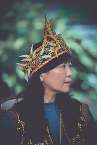 Young woman wearing hat against sky