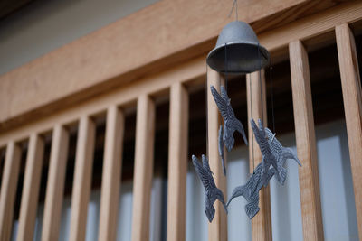 Low angle view of metal railing against building