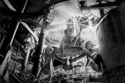 Low angle view of people sitting at ceiling