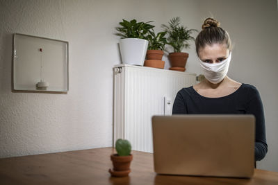 Man using laptop on table